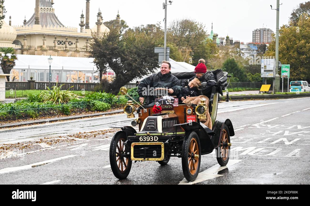 Brighton UK 6th November 2022 - These participants try to stay warm as they arrive in Brighton after taking part in the annual RM Sotheby's London to Brighton Veteran Car Run today . The Run is open to four-wheeled cars, tri-cars and motor tricycles manufactured before 1st January 1905 : Credit Simon Dack / Alamy Live News Stock Photo