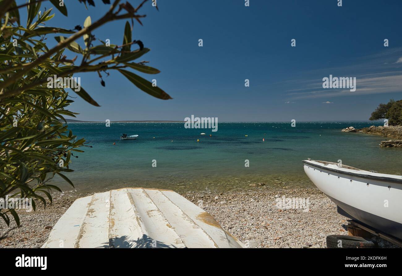 Two small wooden fishing boats on the beach in Italy Stock Photo