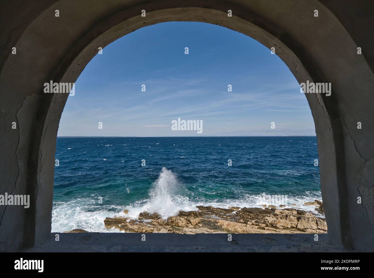 Window overlooking the sea and surf in Croatia Stock Photo