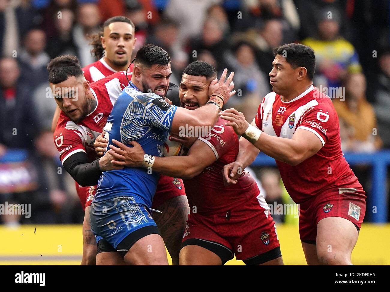 samoa-s-royce-hunt-is-tackled-by-tonga-s-mosese-suli-during-the-rugby