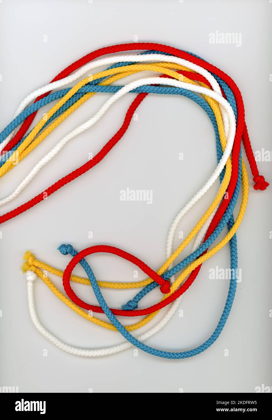 multi colour ropes in white blue yellow and red Stock Photo - Alamy