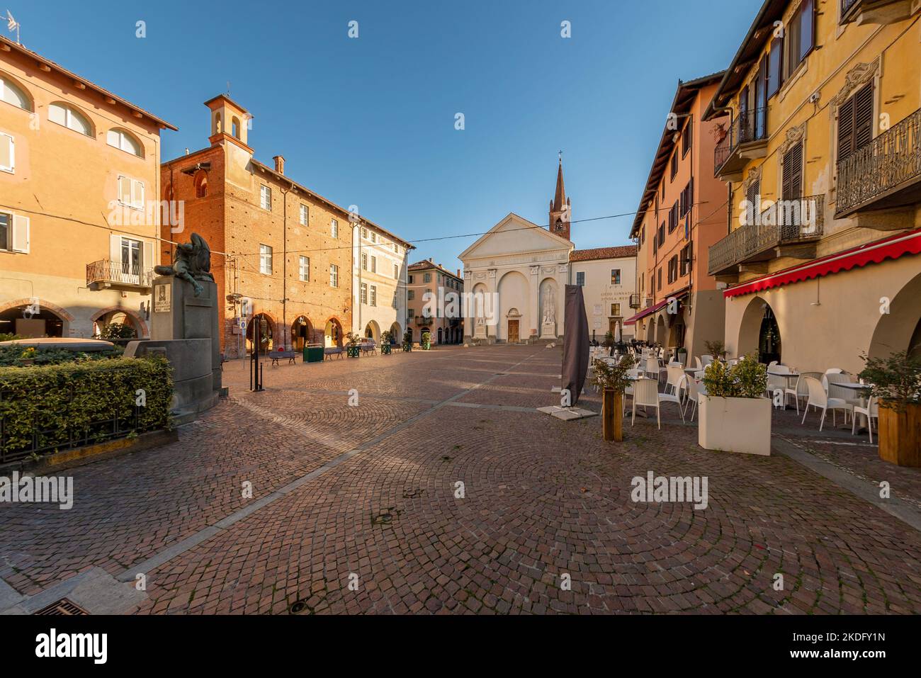 Carmagnola, Turin, Italy - November 05, 2022: Sant Agostino square with Church of Sant'Agostino (15th century) in Gothic style and ancient medieval bu Stock Photo
