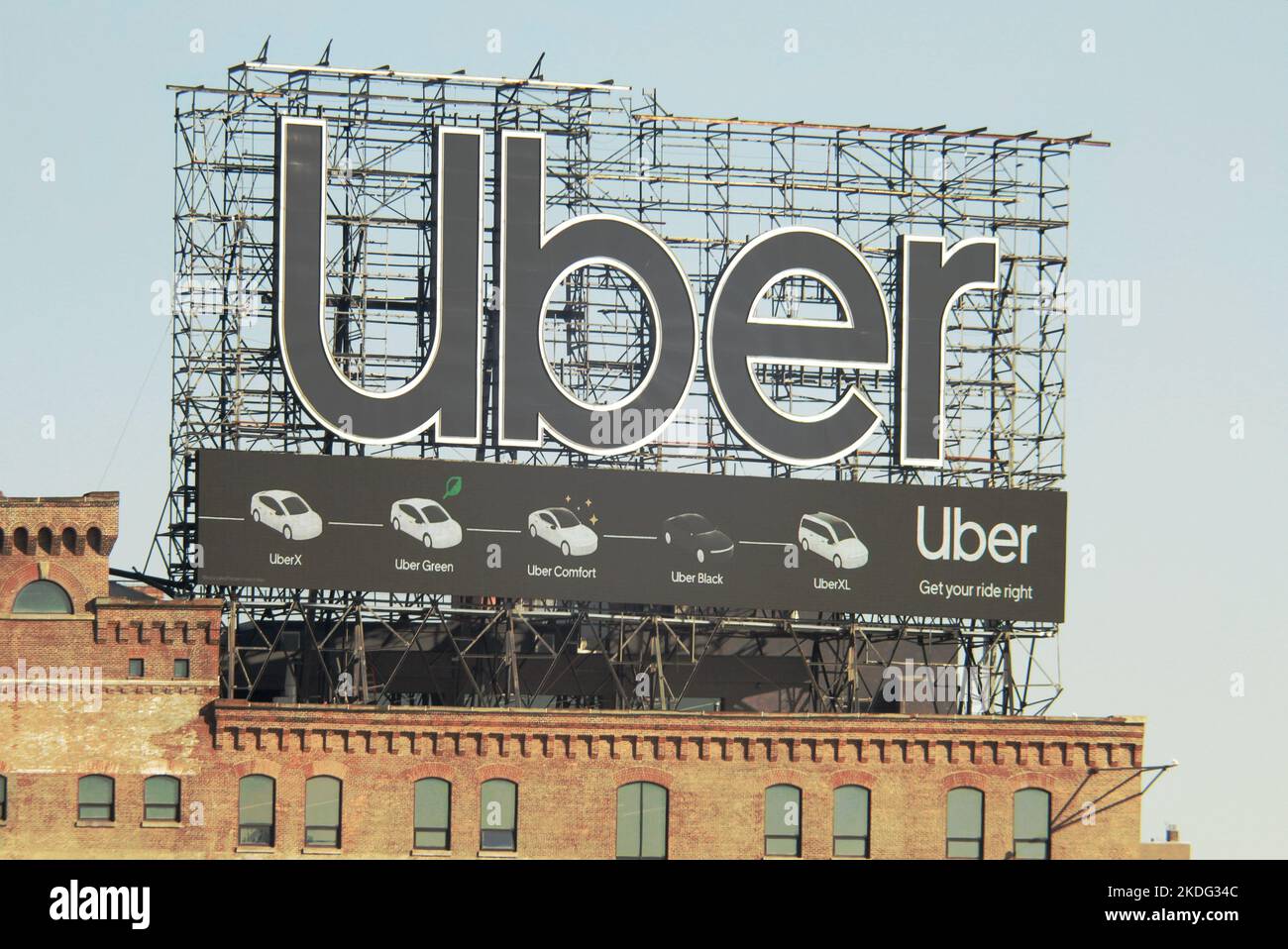 Bronx, NY - ‎November ‎3, ‎2022: Huge Uber car service billboard on top of a city building Stock Photo