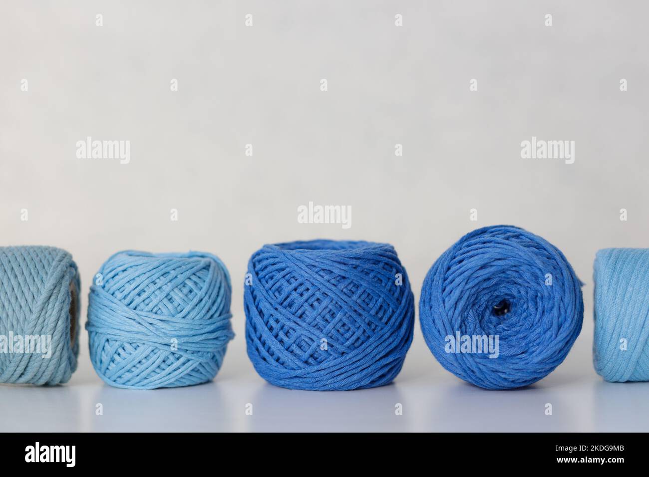 Cotton ropes and cords for needlework and macrame in blue and light blue colors Stock Photo