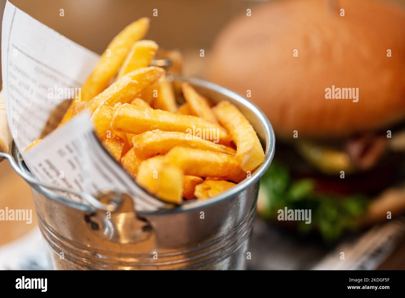 close up of french fries and burger at restaurant Stock Photo