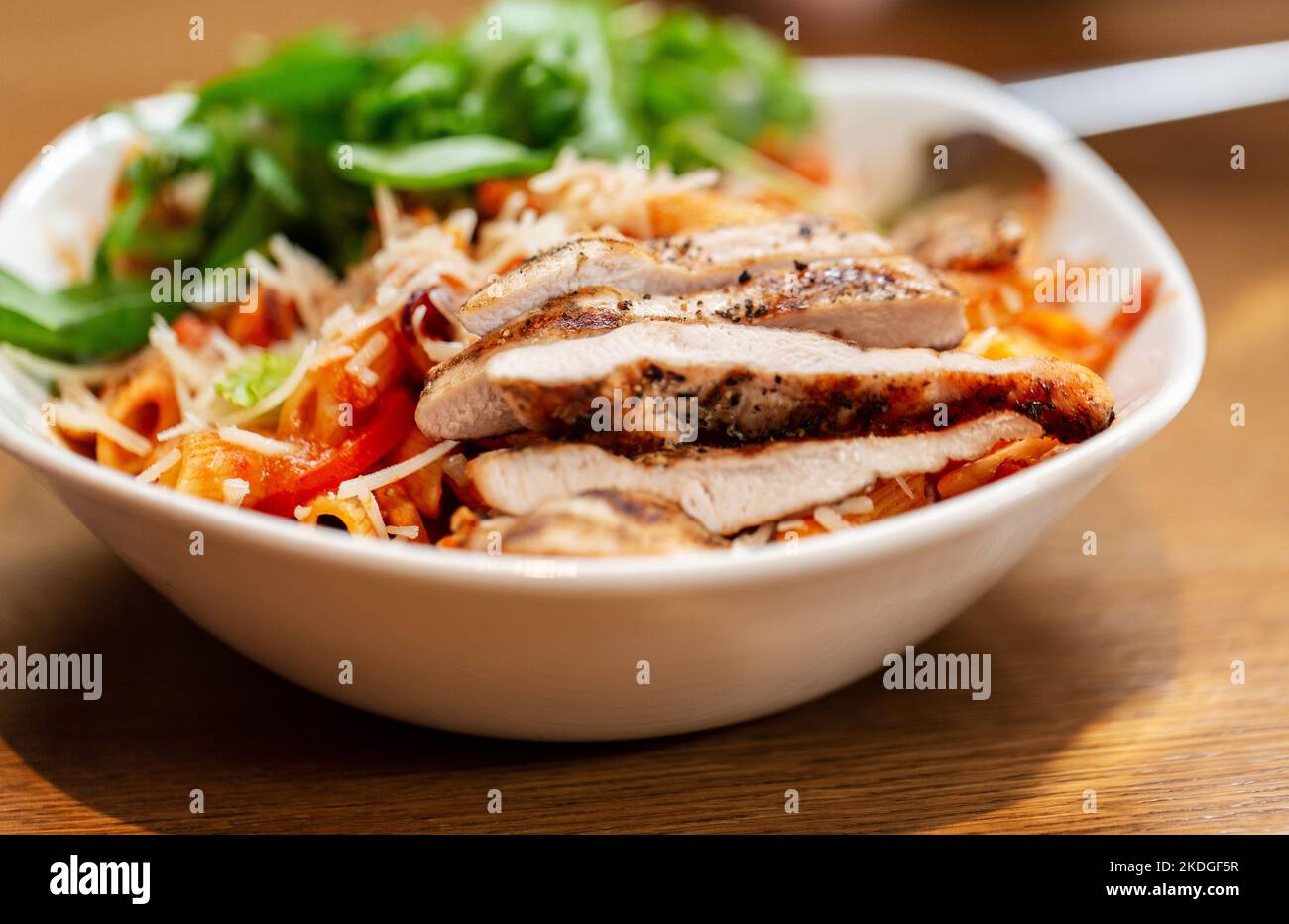 close up of chicken pasta with vegetables on plate Stock Photo