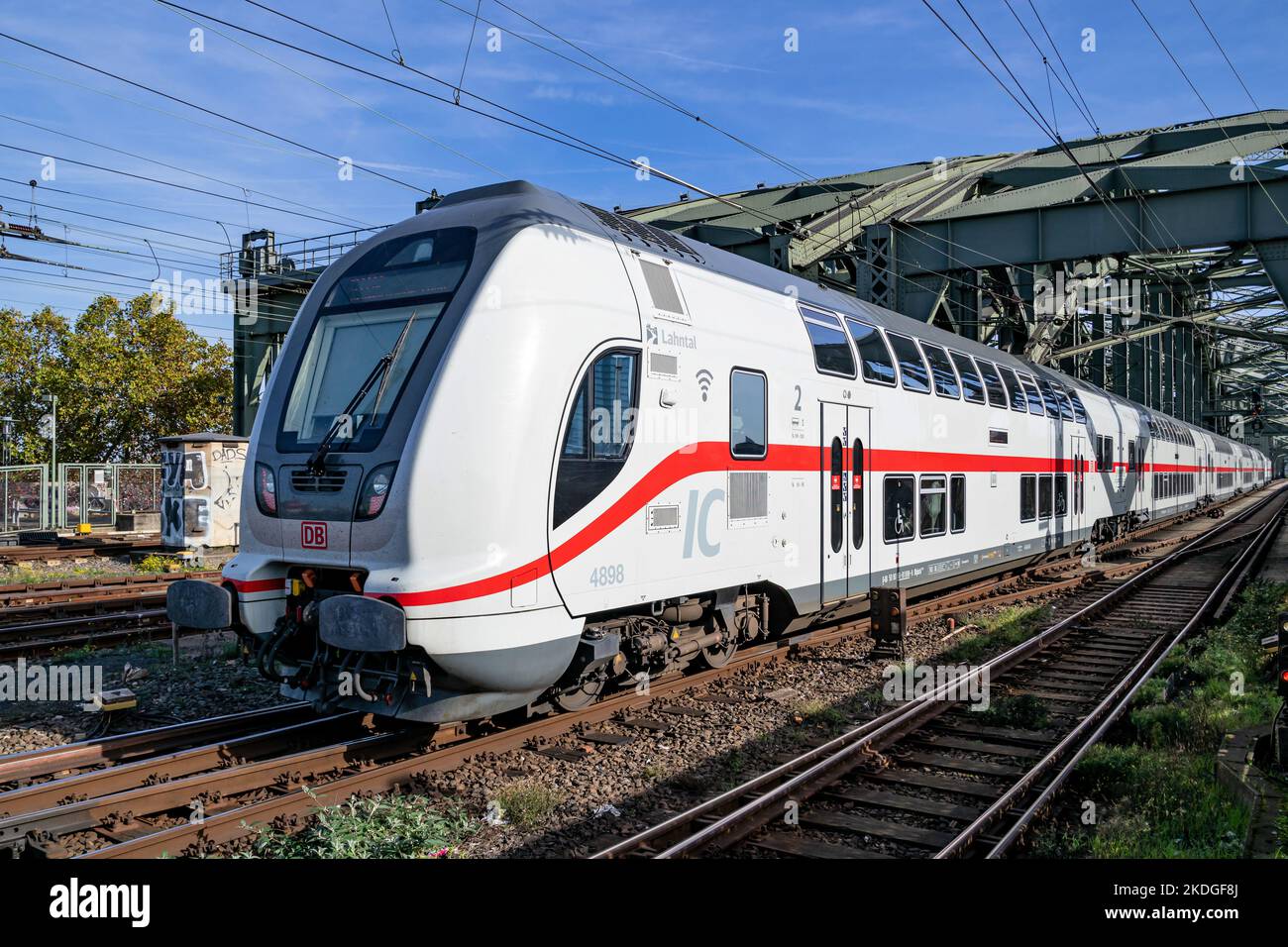 DB Intercity 2 train on the Hohenzollern Bridge in Cologne, Germany Stock Photo