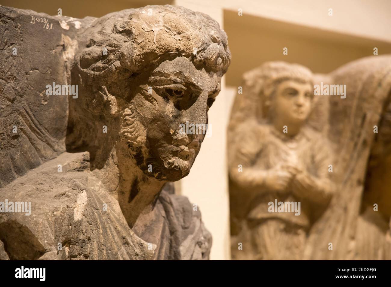 Leiden, The Netherlands - JAN 04, 2020: limestone Palmyrene funerary relief from ancient roman empire of man with curly hair and beard. Syria, Palmyra Stock Photo