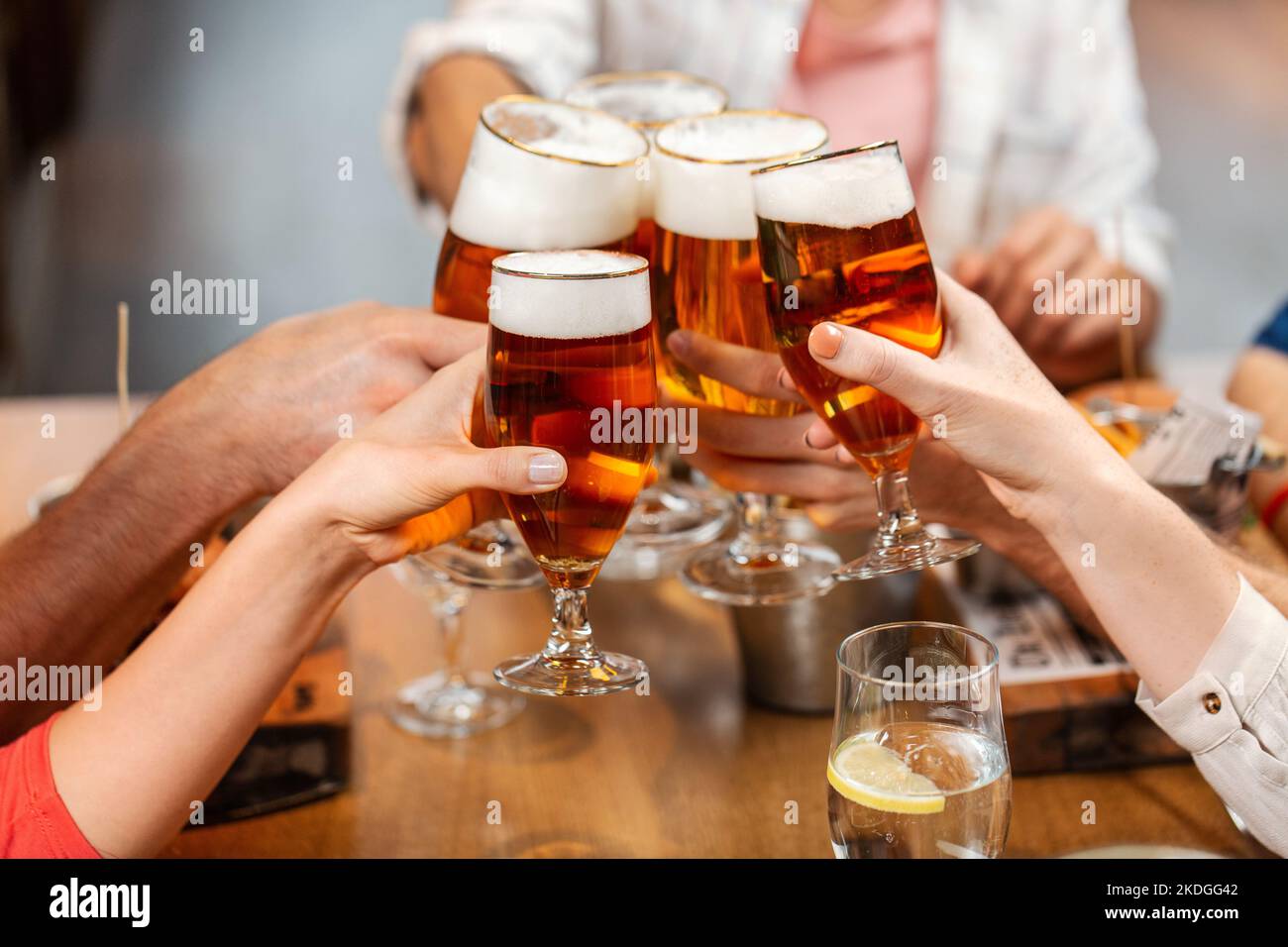 happy friends drinking beer at restaurant Stock Photo