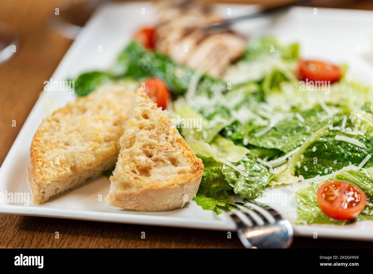 close up of toasted bread and vegetables on plate Stock Photo