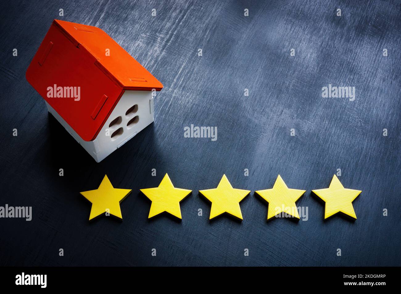 Model of home and five stars. Real estate appraisal concept Stock Photo Alamy