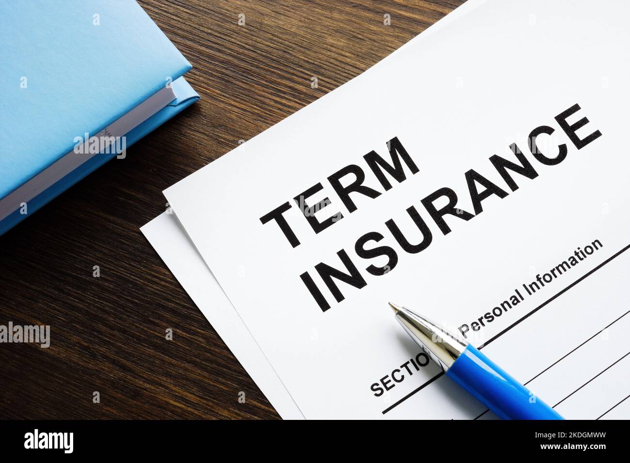Term insurance application papers and a notepad. Stock Photo