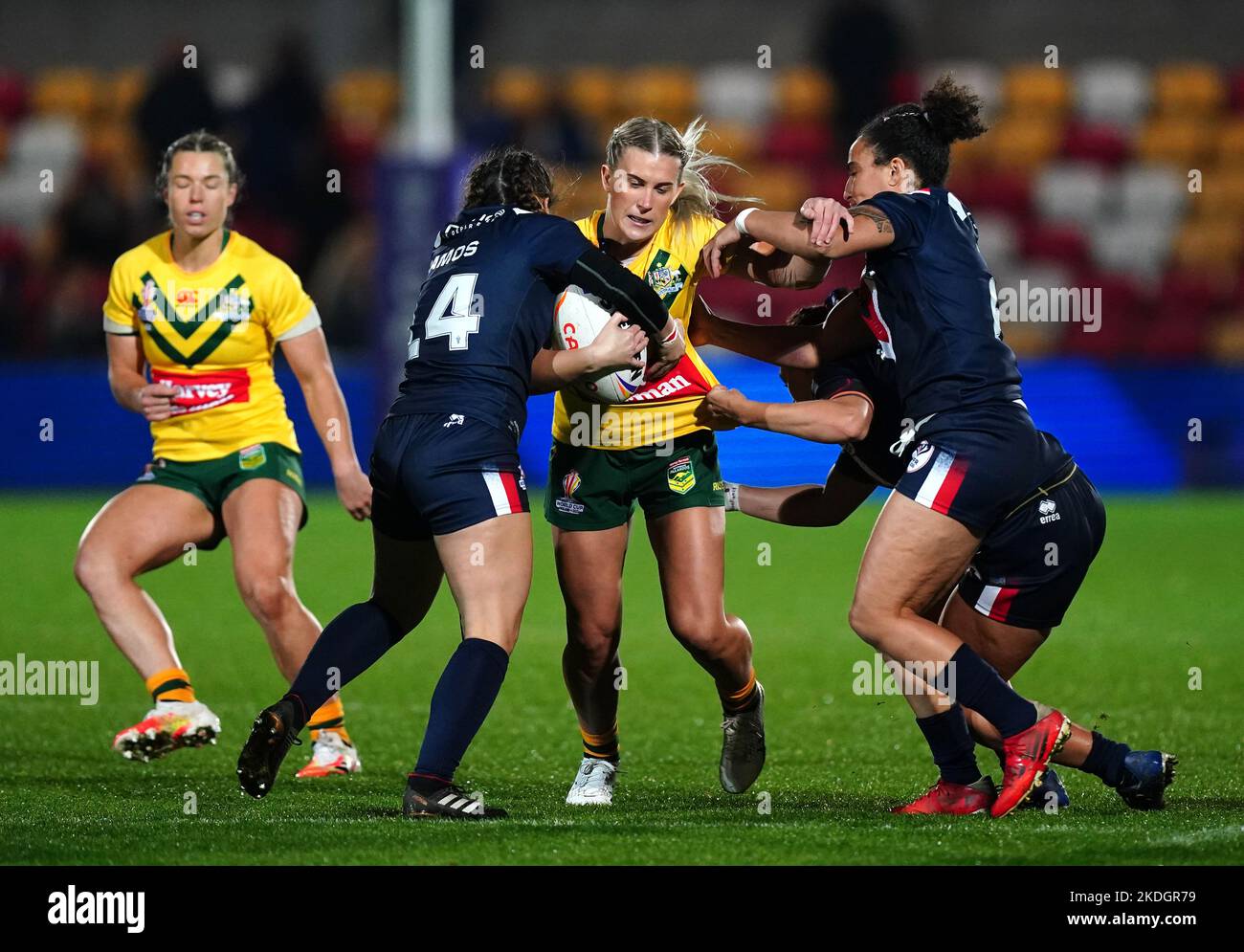 Australia's Shenae Ciesiolka tackled by France's Fanny Ramos (left) and France's Elisa Ciria during the Women's Rugby League World Cup Group B match at the LNER Community Stadium, York. Picture date: Sunday November 6, 2022. Stock Photo