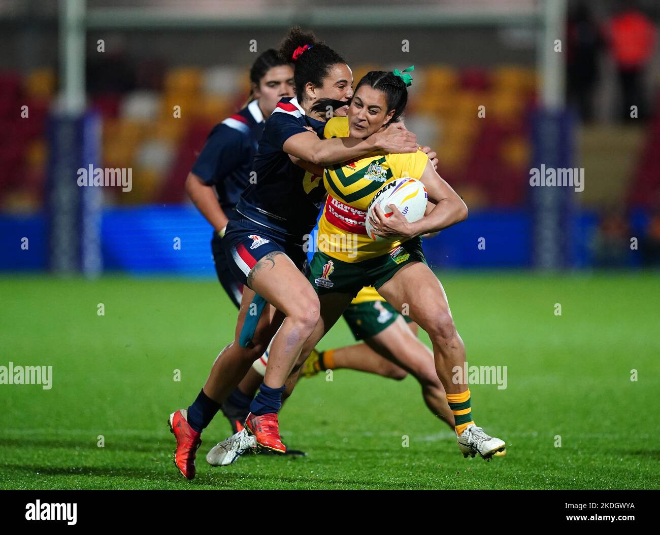 Australia's Yasmin Clydsdale (right) tackled by France's Elisa Ciria during the Women's Rugby League World Cup Group B match at the LNER Community Stadium, York. Picture date: Sunday November 6, 2022. Stock Photo