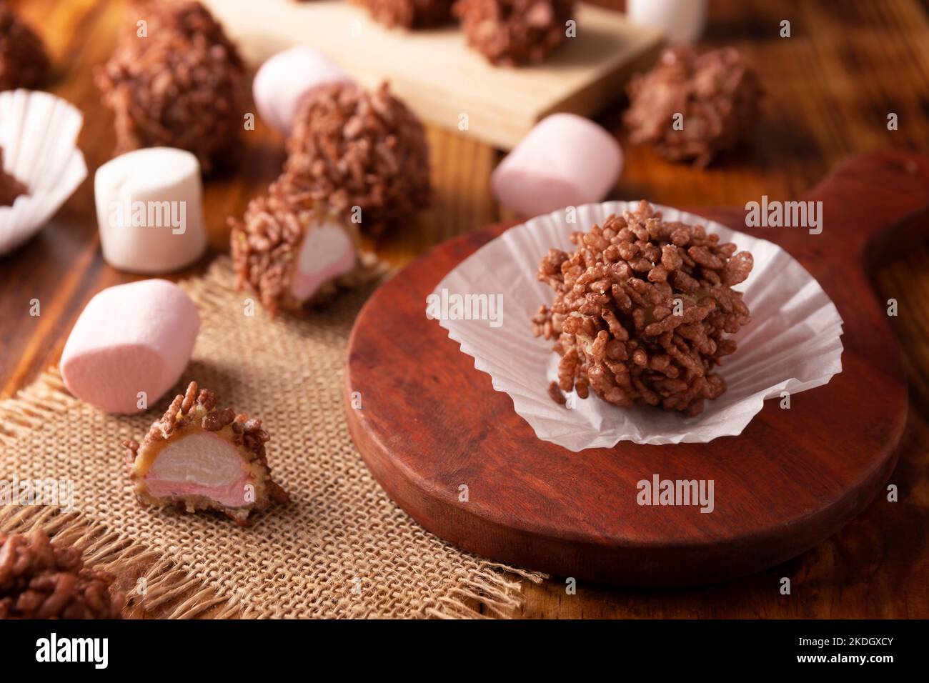 Homemade Caramel Marshmallows covered in chocolate flavor puffed rice, sweet treat easy to make, no baking required, ideal for parties and festivities Stock Photo