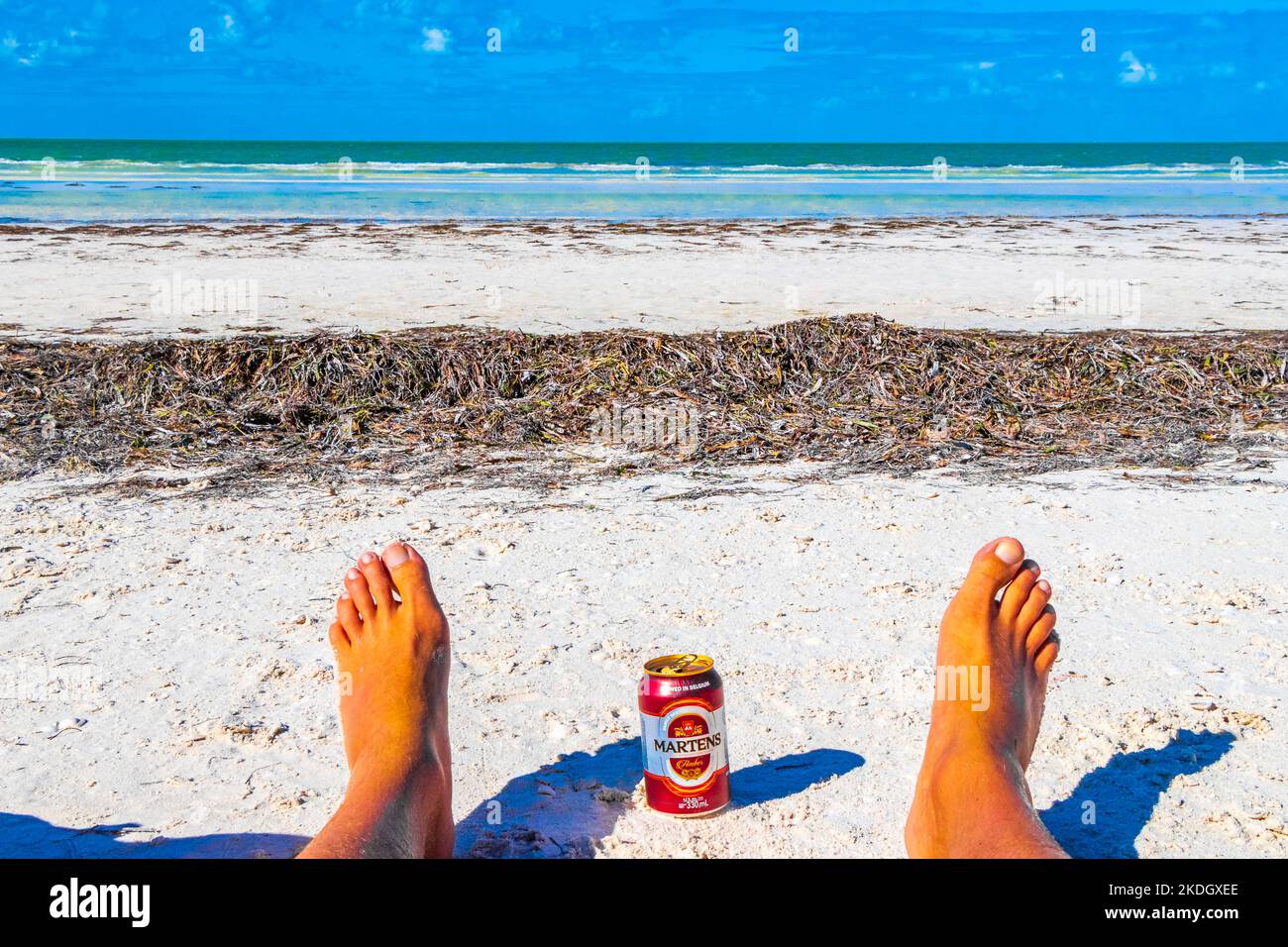 Drinking a can of cold beer Martens on the beach in paradise on Isla Holbox island in Quintana Roo Mexico. Stock Photo