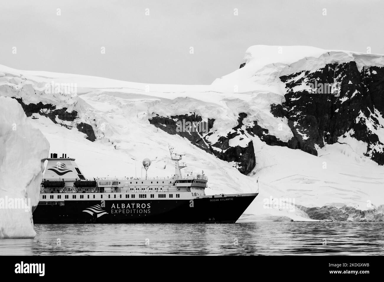 Expedition cruise ship in Antarctica with snow, ice or icebergs behind Stock Photo