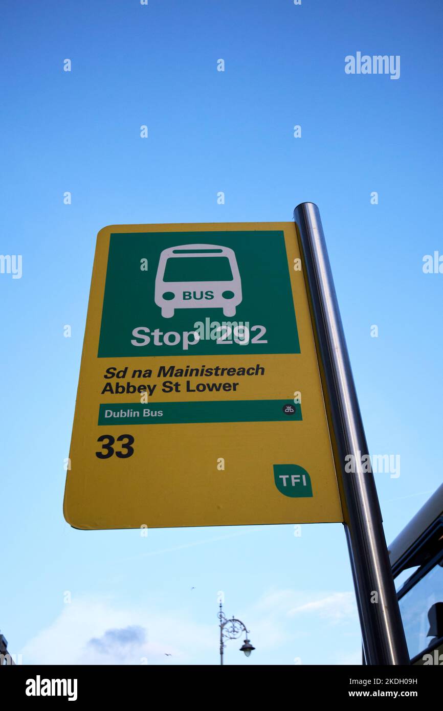 transport for ireland green and yellow dublin bus bus stop on abbey