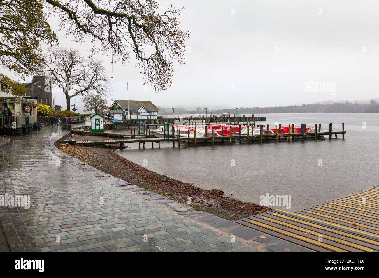 Ambleside Pier and wooden jetty in the Lake District National Park with Lake Windermere on a wet, gloomy, overcast day Stock Photo
