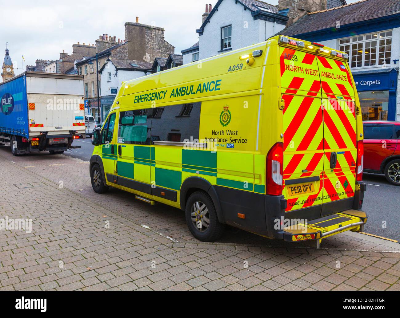 An emergency Ambulance vehicle parked up on the main street in Kendal, Cumbria, England, UK Stock Photo