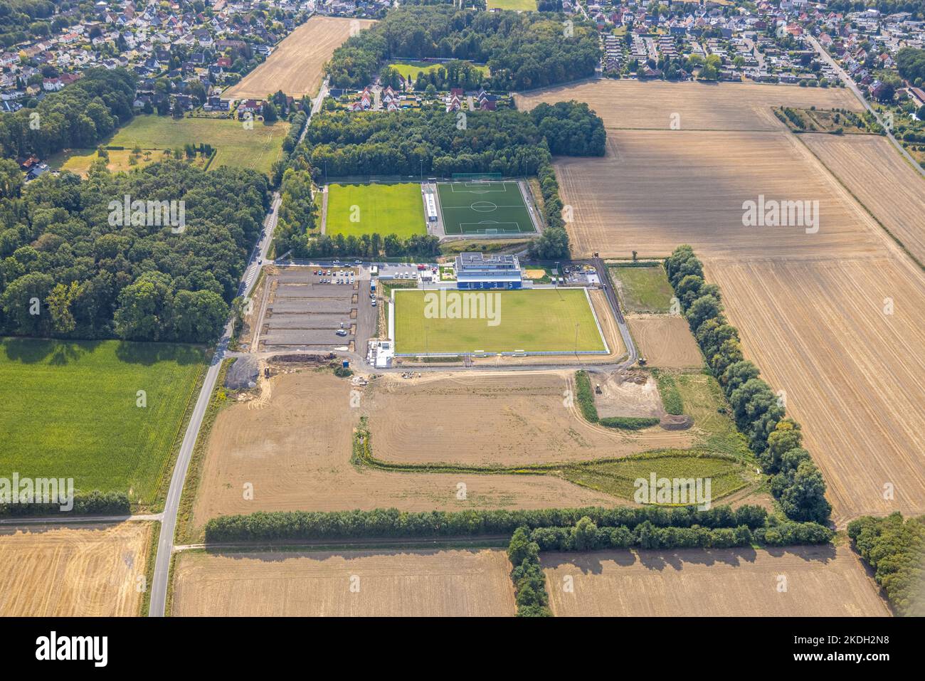 Aerial view, construction site and new building sports field with stands and club building with sports day care center, An der Lohschule, Rhynern, Ham Stock Photo