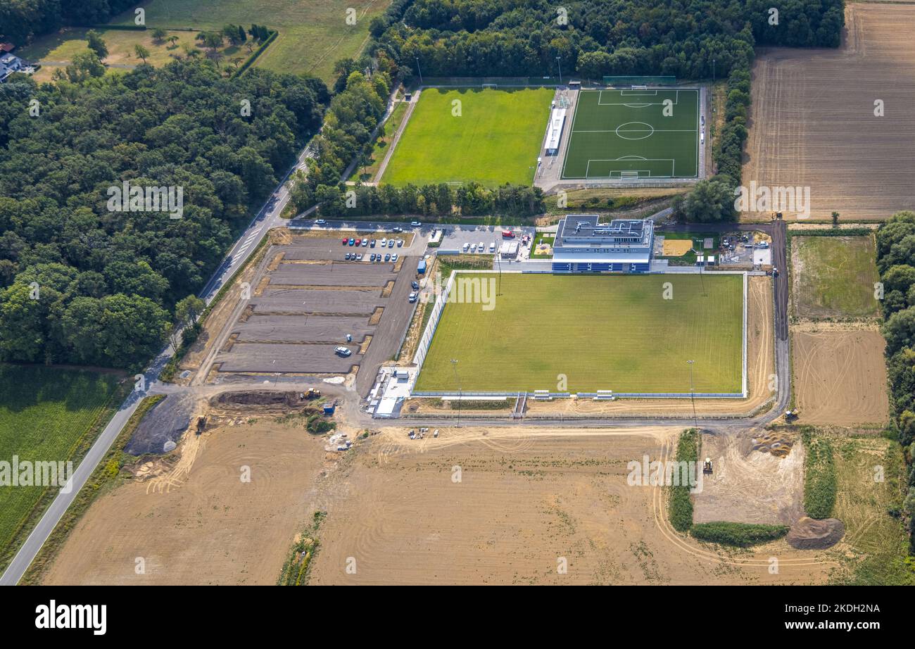 Aerial view, construction site and new construction sports field with stands and club building with sports day care center, An der Lohschule, Rhynern, Stock Photo