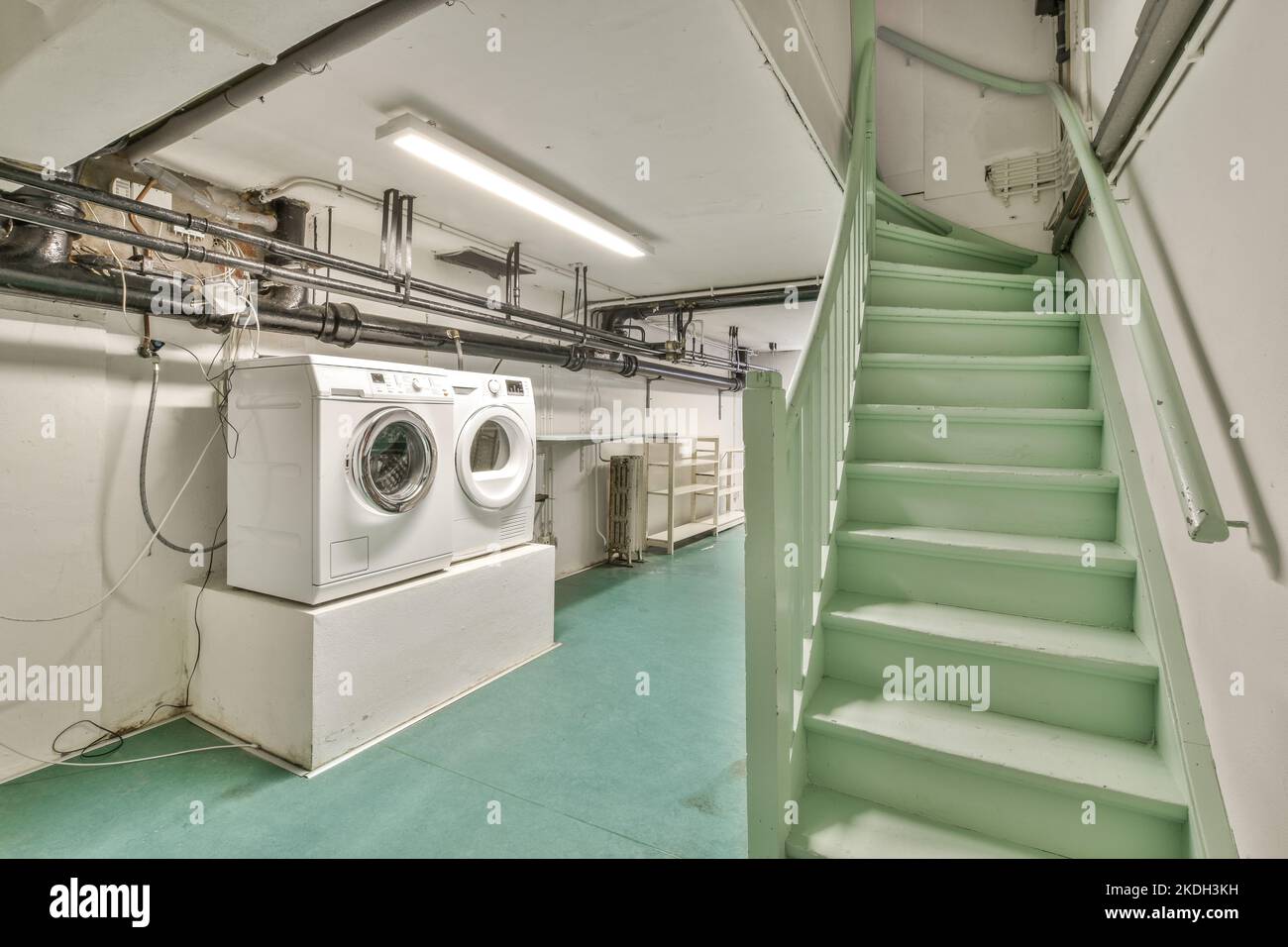Boiler room of an apartment building with pipes and metering devices. A