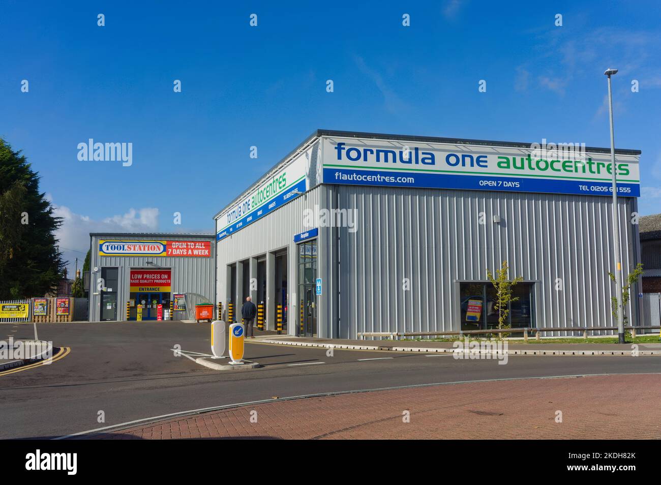 Formula one autocentres garage with a blue sky background on Lister Way, Boston Lincs. Stock Photo