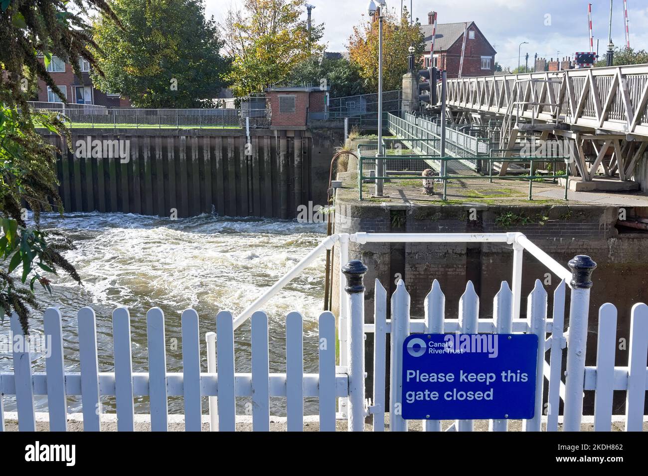 Water flows from the lock gates under the Sluice bridge on the river