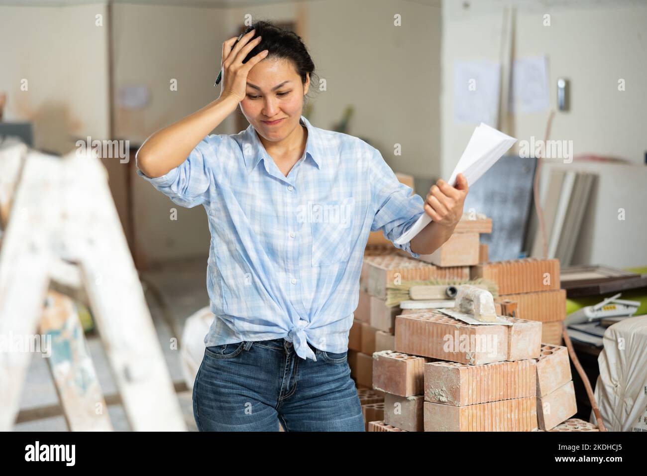 Portrait of an upset woman dissatisfied with progress of apartment(02)