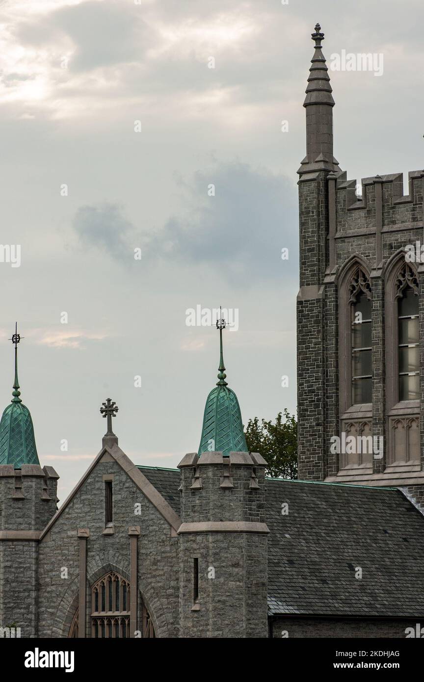 Partial photo of St. Bridgets Cathedral on Midvale Avenue in Philadelphia, Pennsylvania, against a cloudy sky. Stock Photo