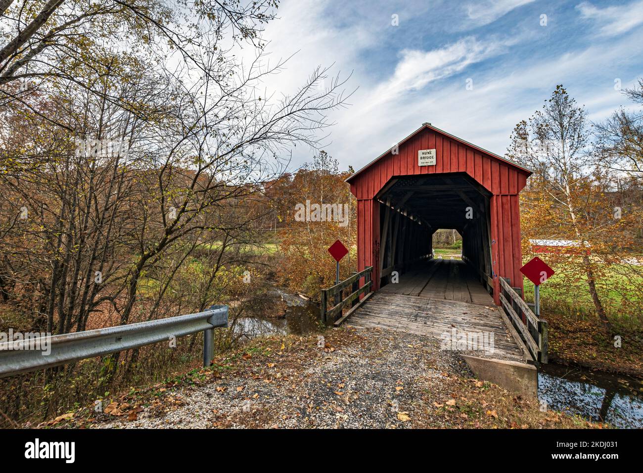 Marietta, Ohio, USA-Oct. 25, 2022: Historic Hune Covered Bridge built in 1879 in this location over the Little Muskingum River and restored in 1998. Stock Photo