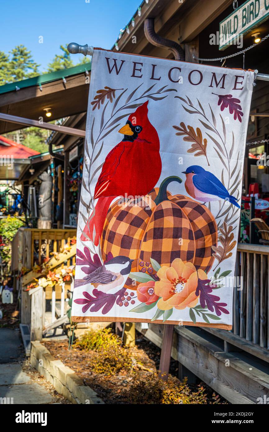 Fall season 'Welcome' porch flag at Zoller Hardware in the Blue Ridge Mountains town of Cashiers, North Carolina. (USA) Stock Photo