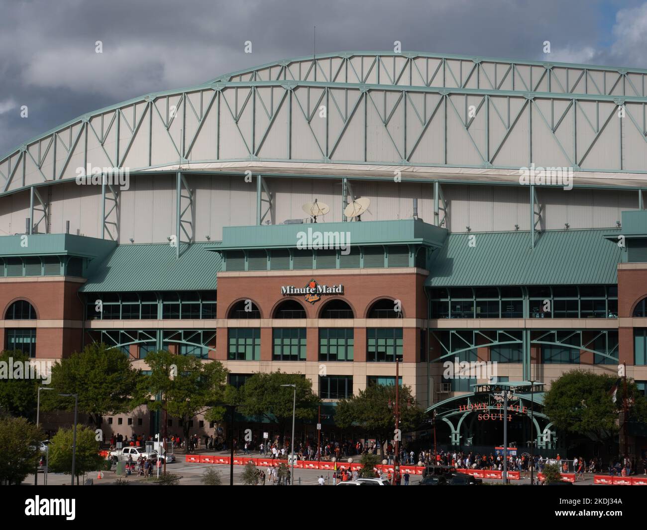 Line of Astros Fans Waiting to Enter the Team Store at Minute Maid Stadium in Houston after the 2022 World Series Win with clouds above and a parking Stock Photo