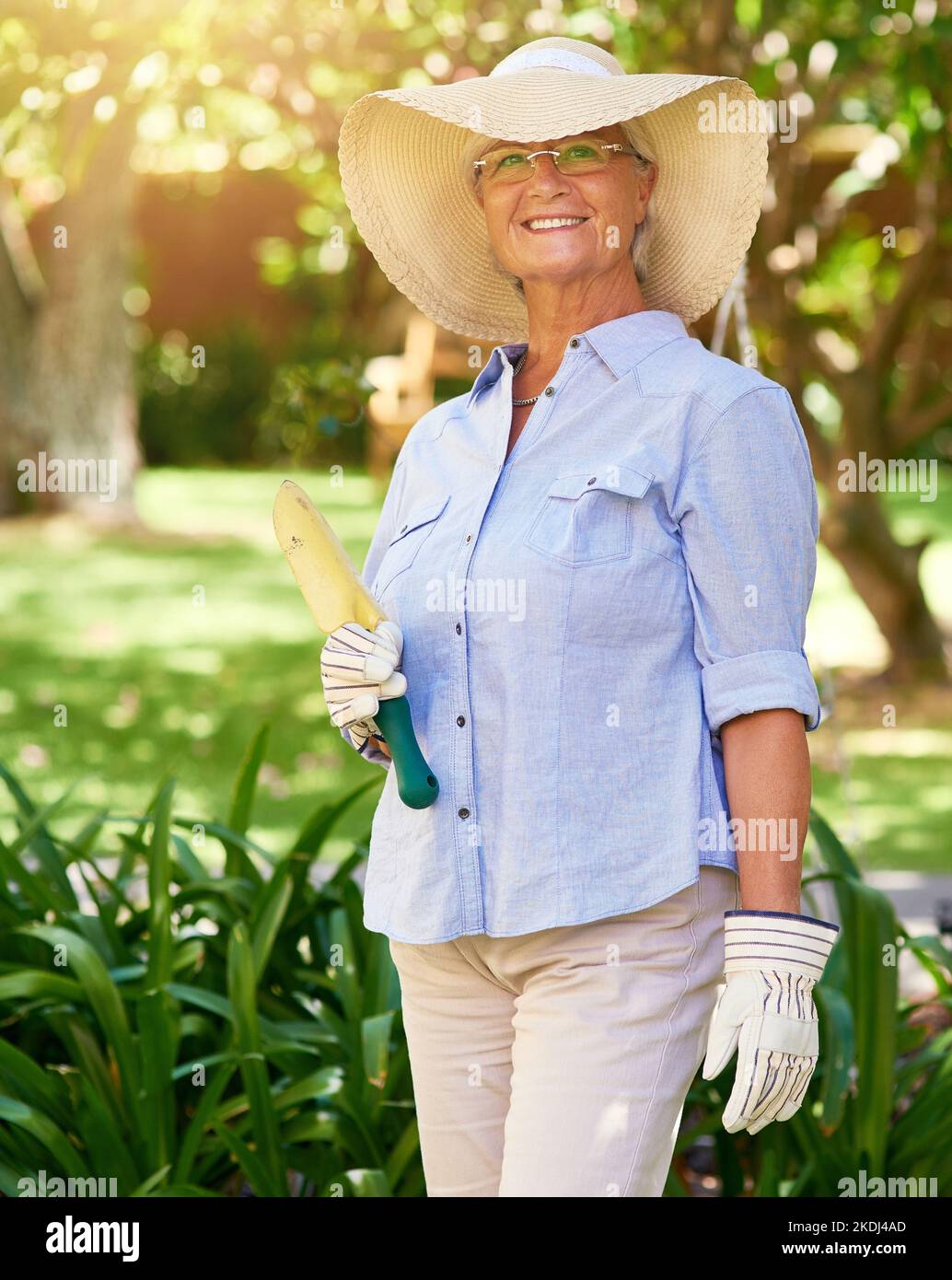 Gardening made my retirement a happy one. Portrait of a happy senior woman enjoying a bit of gardening. Stock Photo