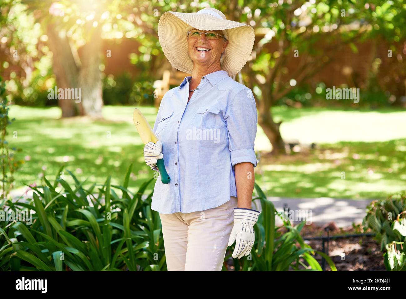 Gardening time. Portrait of a happy senior woman enjoying a bit of gardening. Stock Photo