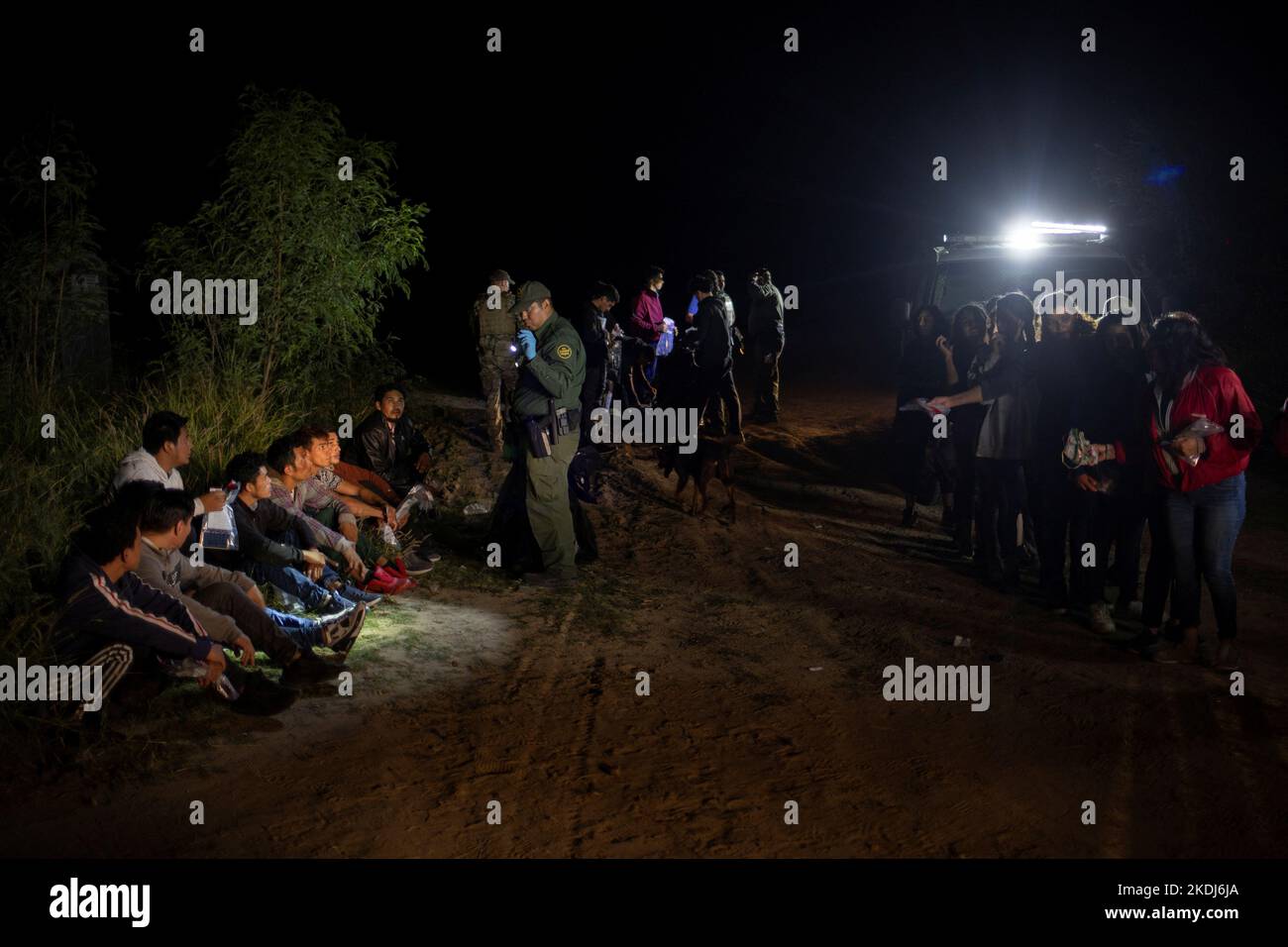 Border patrol agents process asylum seeking migrants from Central America who were smuggled from Mexico into Roma, Texas, U.S., November 6, 2022.  REUTERS/Adrees Latif Stock Photo