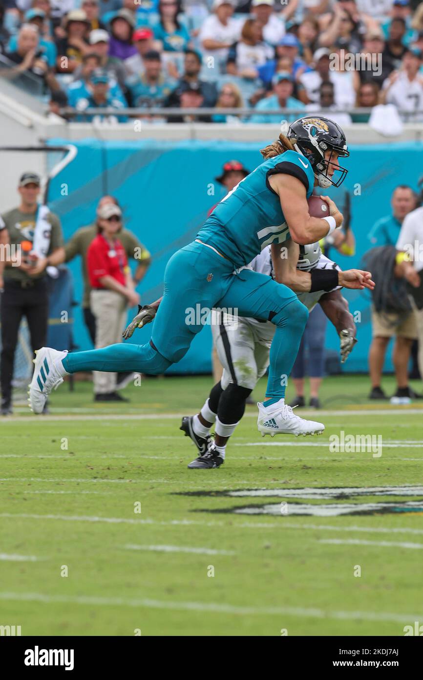Saturday, November 6, 2022; Jacksonville, FL USA;  Jacksonville Jaguars quarterback Trevor Lawrence (16) runs with the ball for the first down during Stock Photo