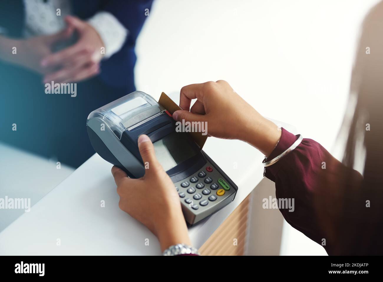 One swipe and youre all paid. an unrecognisable person swiping a credit card for payment. Stock Photo