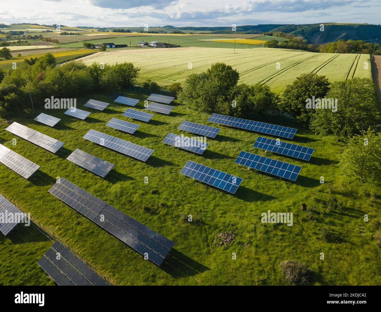 An aerial view of a large solar plant in a meadow Stock Photo