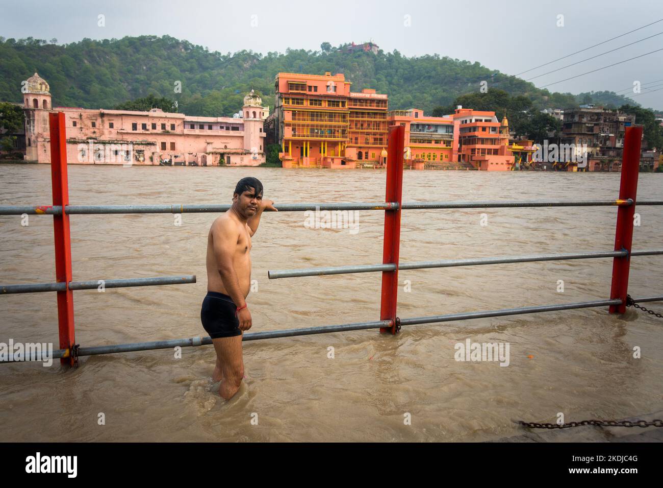 July 8th 2022 Haridwar India. A man offering prayers and having a dip at Har Ki Pauri during Ganga Snan. Stock Photo