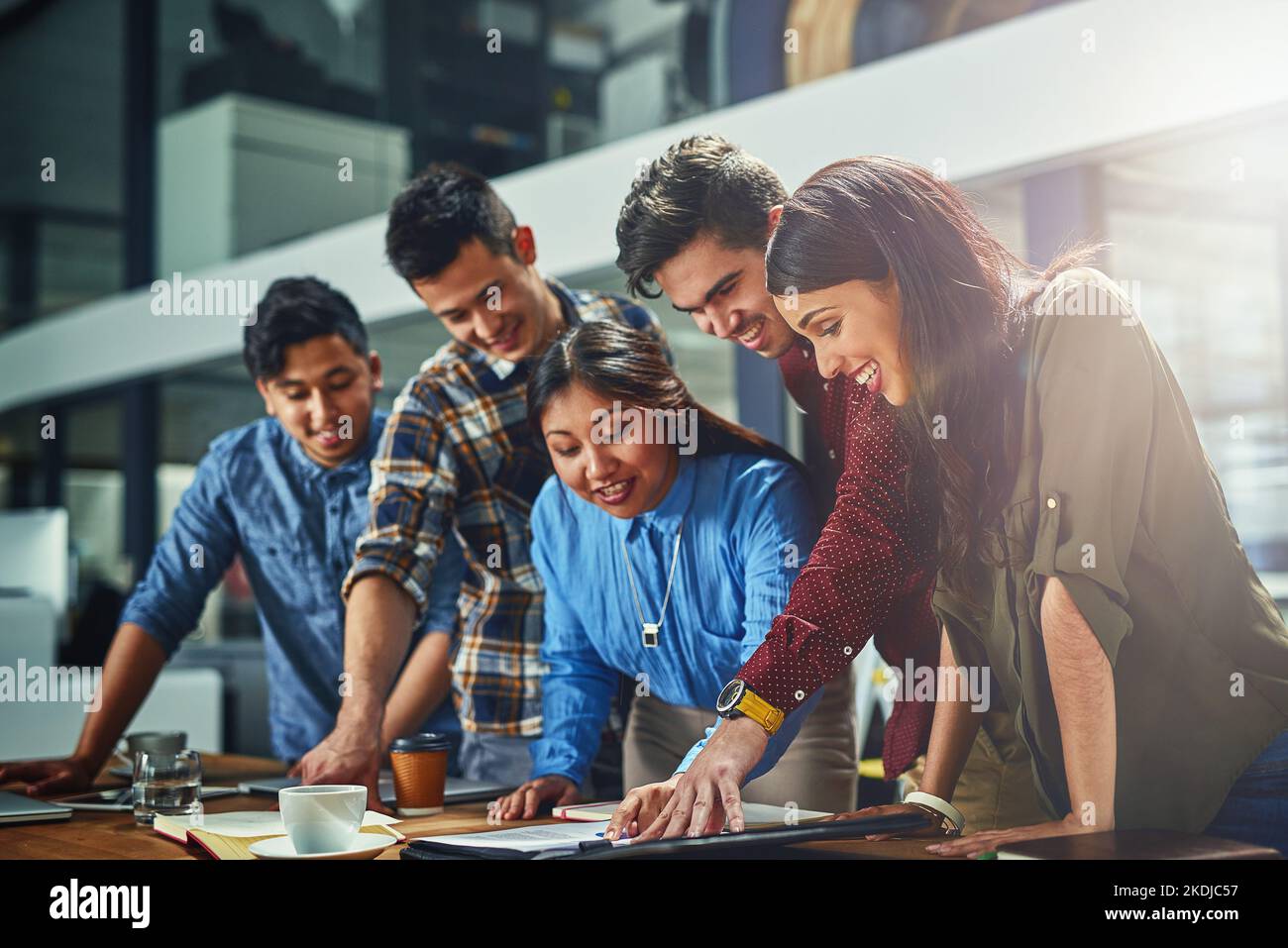 Conceiving their next big concept. a team of designers working together in an office. Stock Photo