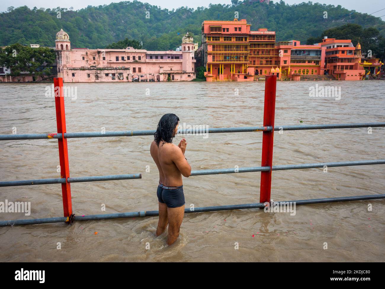 July 8th 2022 Haridwar India. A man offering prayers and having a dip at Har Ki Pauri during Ganga Snan. Stock Photo