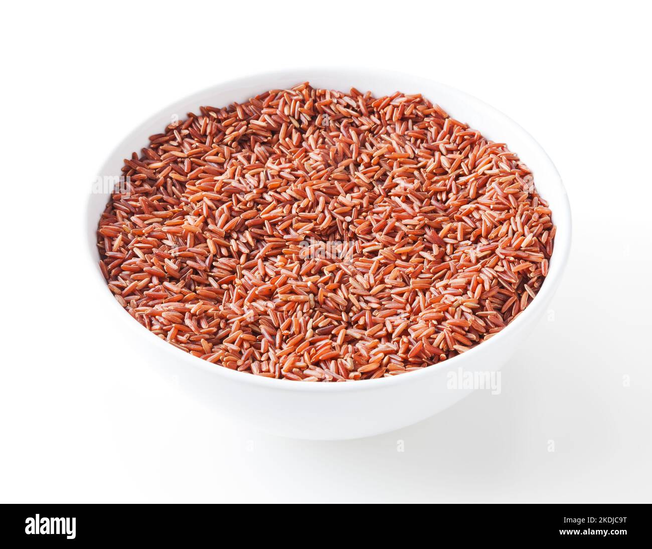 Uncooked red rice in white bowl isolated on white background with clipping path Stock Photo