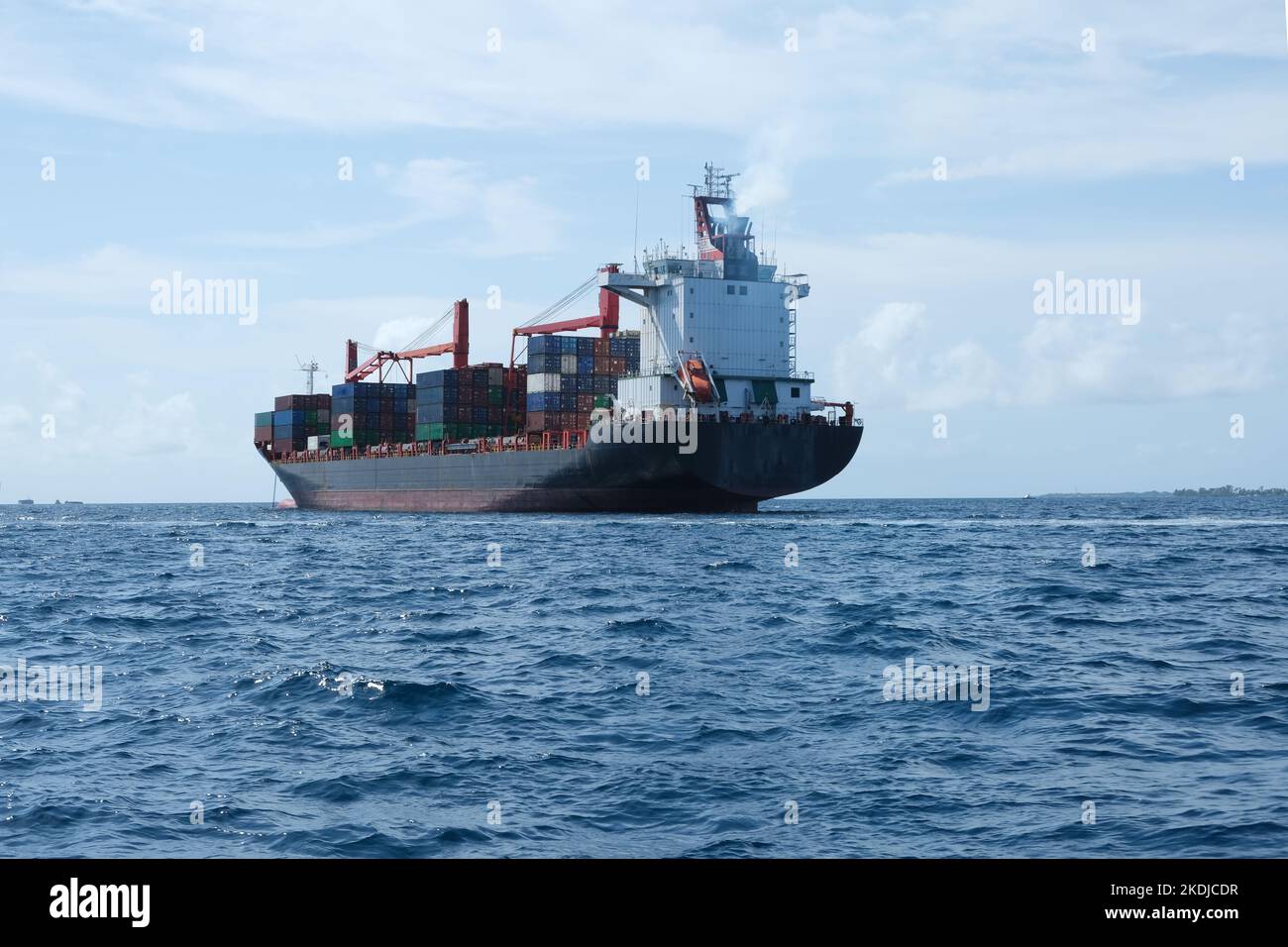 A big vessel ship that carrying the stocks and goods at the sea of Male, Maldives. Stock Photo