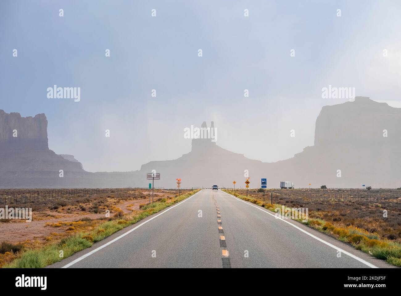 Highway leading towards geological features in Monument Valley desert