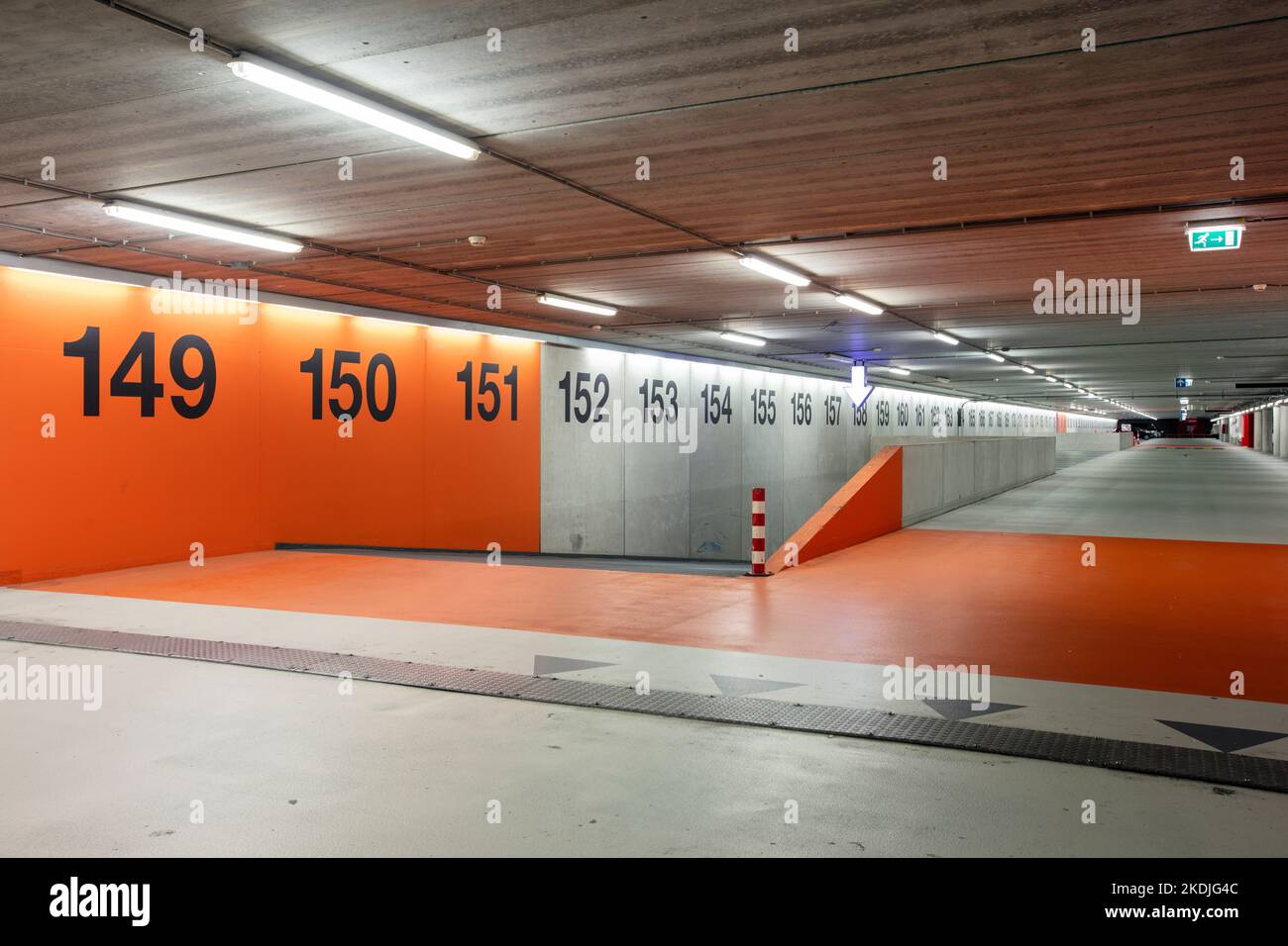 Rotterdam, Netherlands – October 11, 2022 : Almost empty indoor parking garage with row numbers Stock Photo