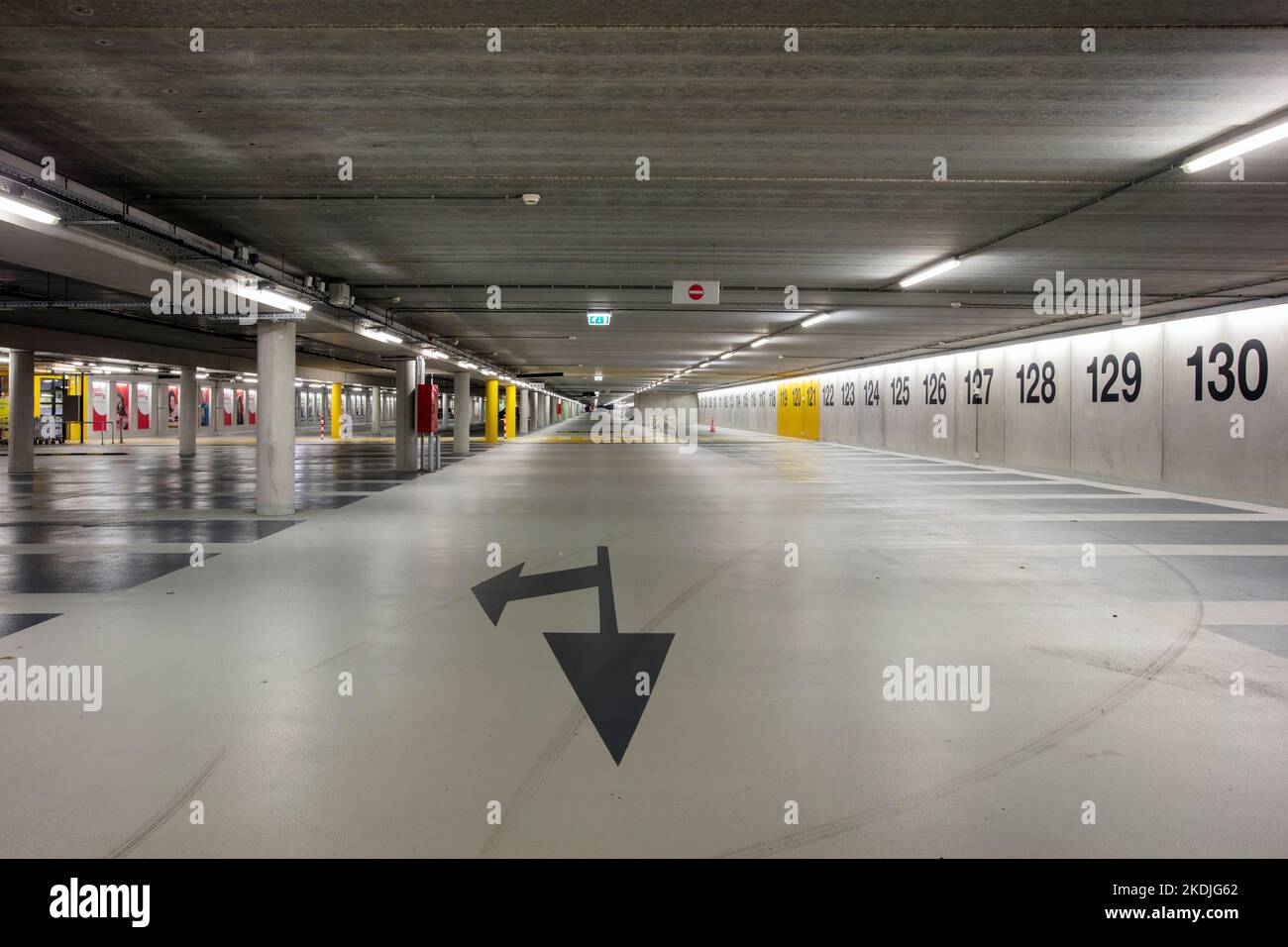 Rotterdam, Netherlands – October 11, 2022 : Almost empty indoor parking garage with road mark and row numbers Stock Photo