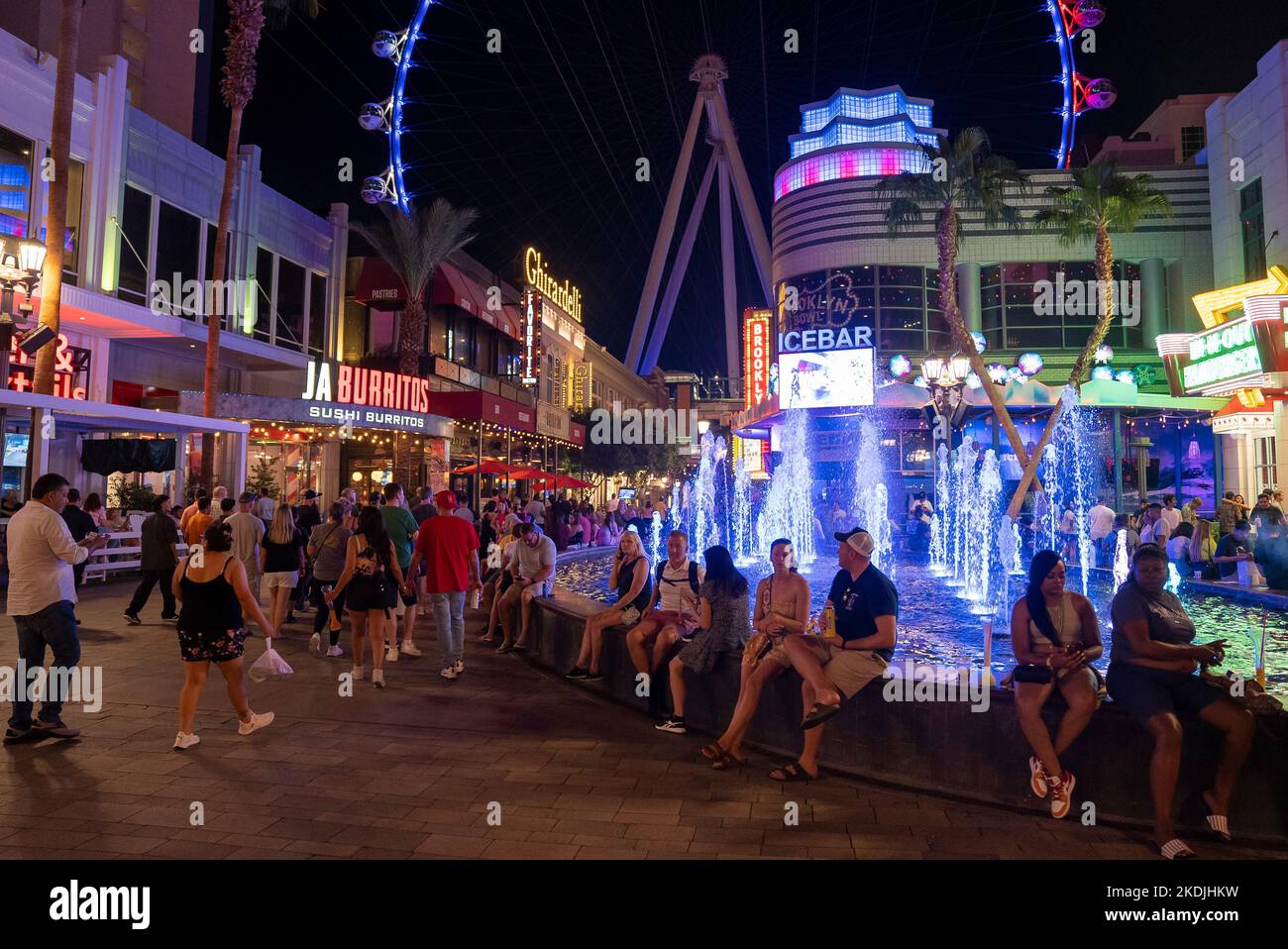 Tourists spending leisure time in illuminated LINQ promenade at night Stock Photo