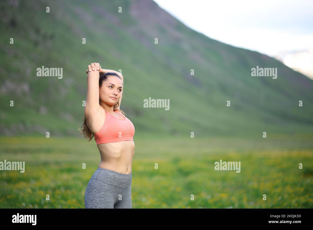 Young Athletic Woman Freely Stretching Her Arms To Nature High-Res Stock  Photo - Getty Images